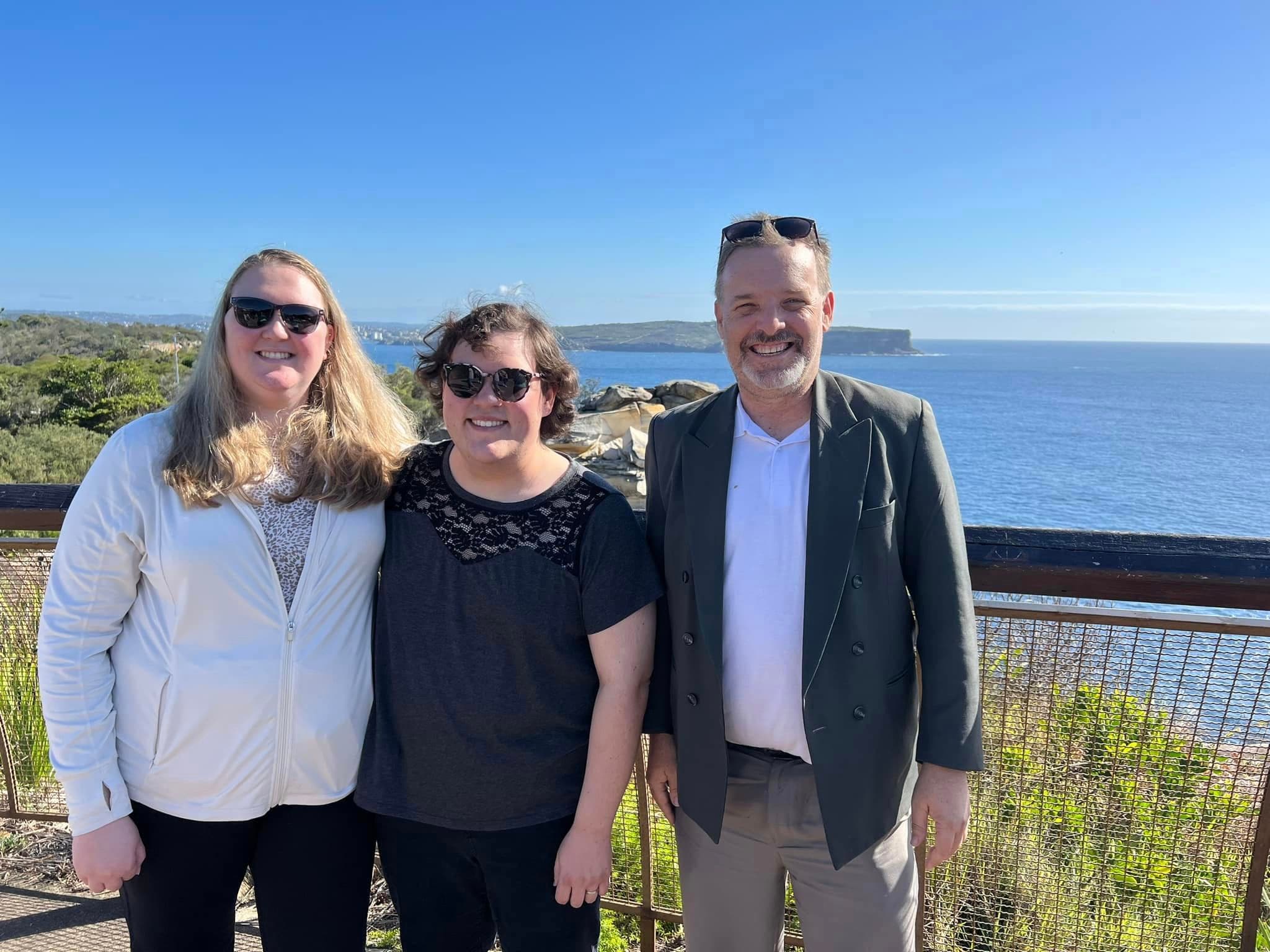 Private tour guests at a scenic Sydney coastal lookout
