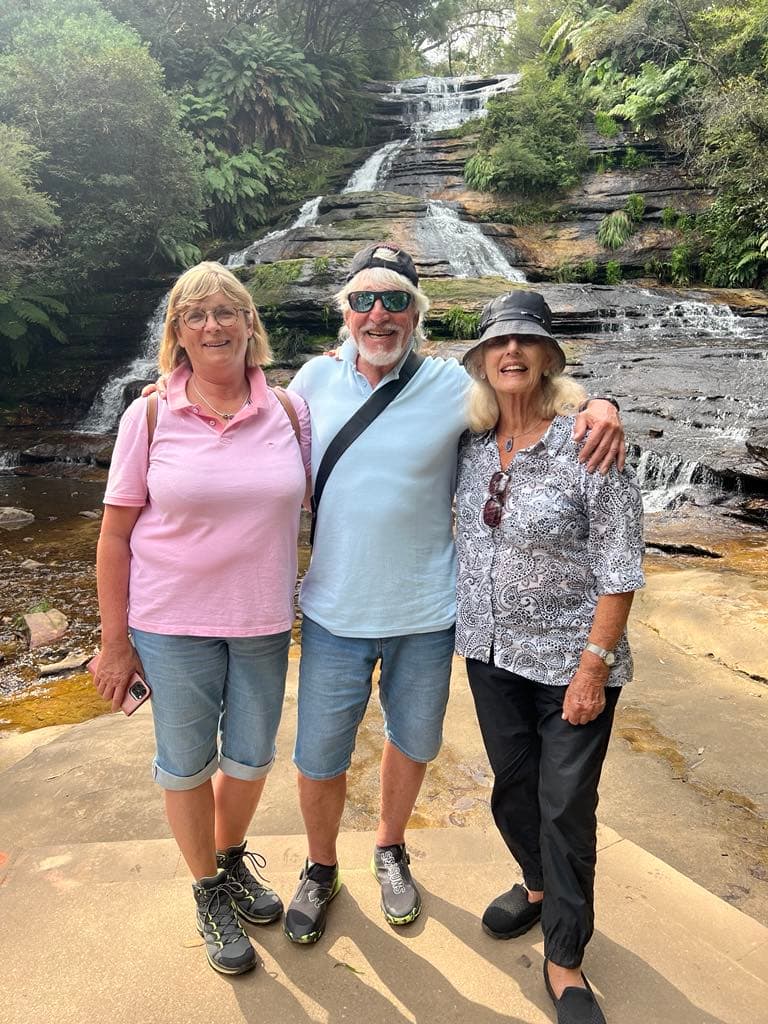 Tour guests at a Blue Mountains waterfall lookout